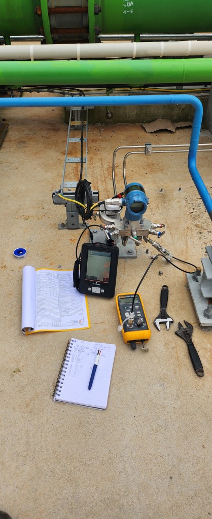 A man lying on a stretcher in a hospital hallway, accompanied by a doctor and a family member.